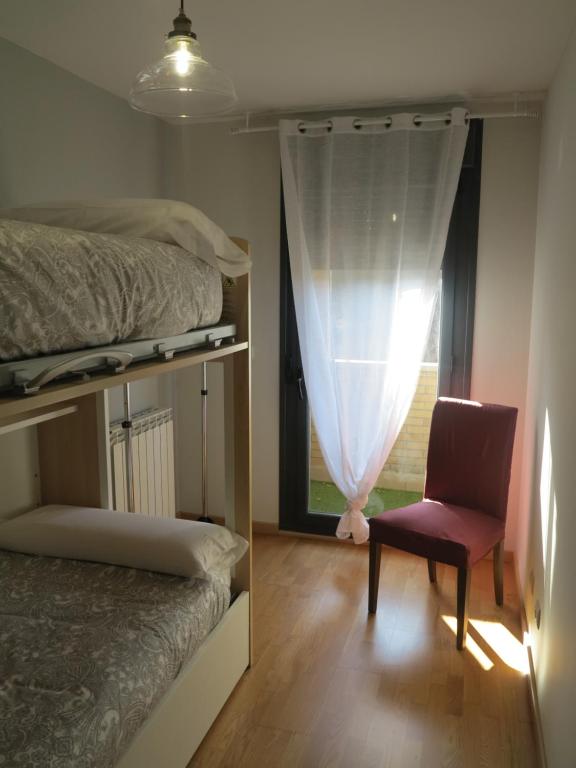 Postel nebo postele na pokoji v ubytování Tudela balcón de Bardenas