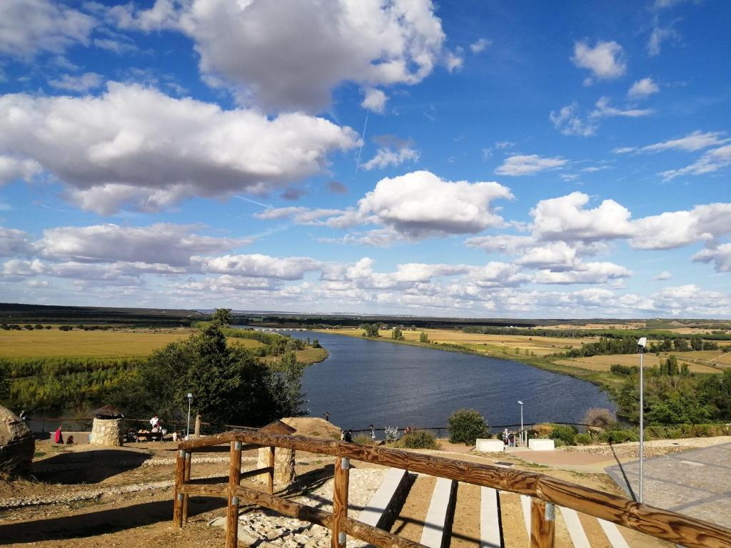 a view of a river under a cloudy sky at El Balcón del Duero 1—2 in Castronuño