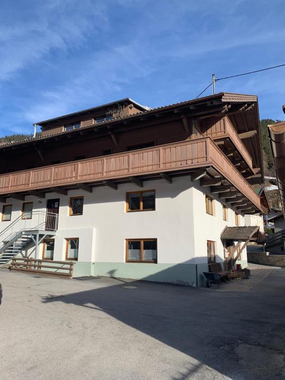 a building with a staircase on the side of it at Haus Brunnenberg in Sölden