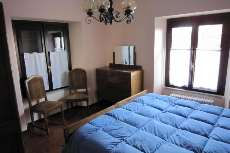 A bed or beds in a room at Agriturismo Monterosso