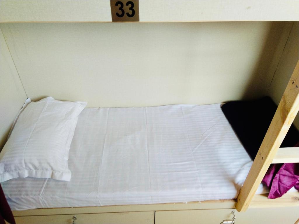 Postel nebo postele na pokoji v ubytování Homestay Ac Dormitory