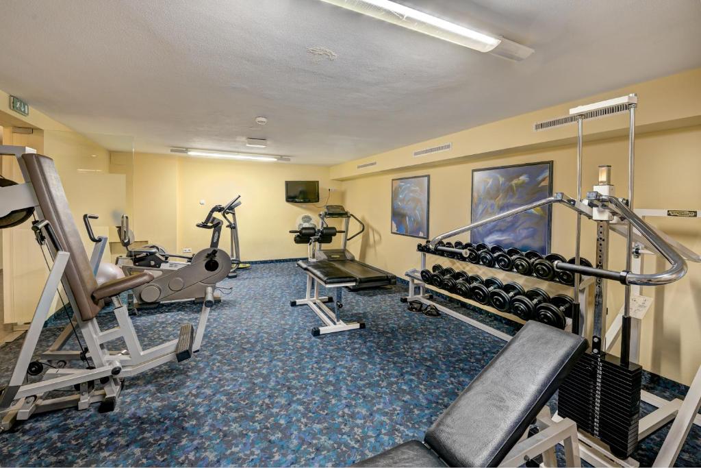 a fitness room with treadmills and machines at Hotel Brigitte in Ischgl
