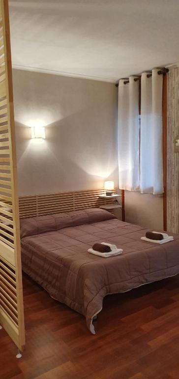 A bed or beds in a room at Relax Just Relax Fiuggi