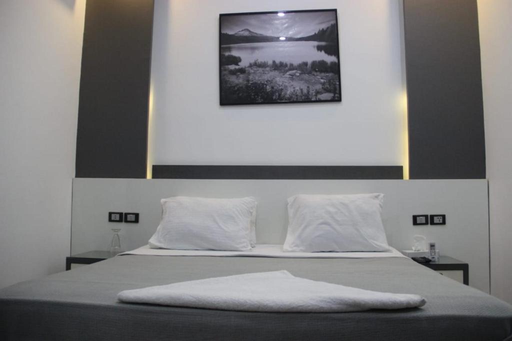 Postel nebo postele na pokoji v ubytování Azar Boutique Hotel
