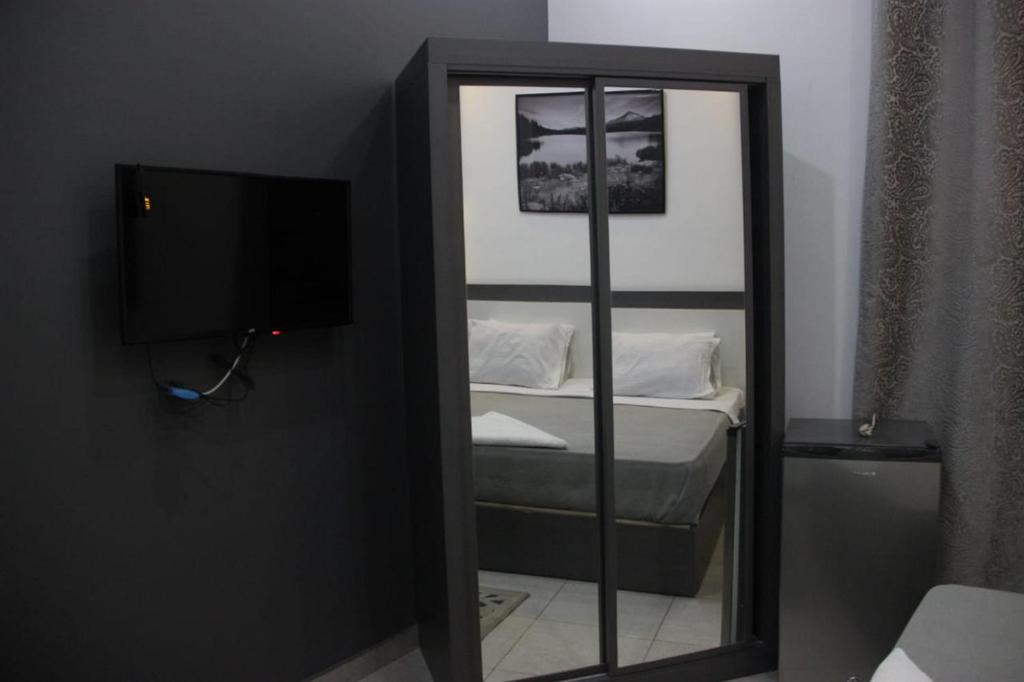 Postel nebo postele na pokoji v ubytování Azar Boutique Hotel