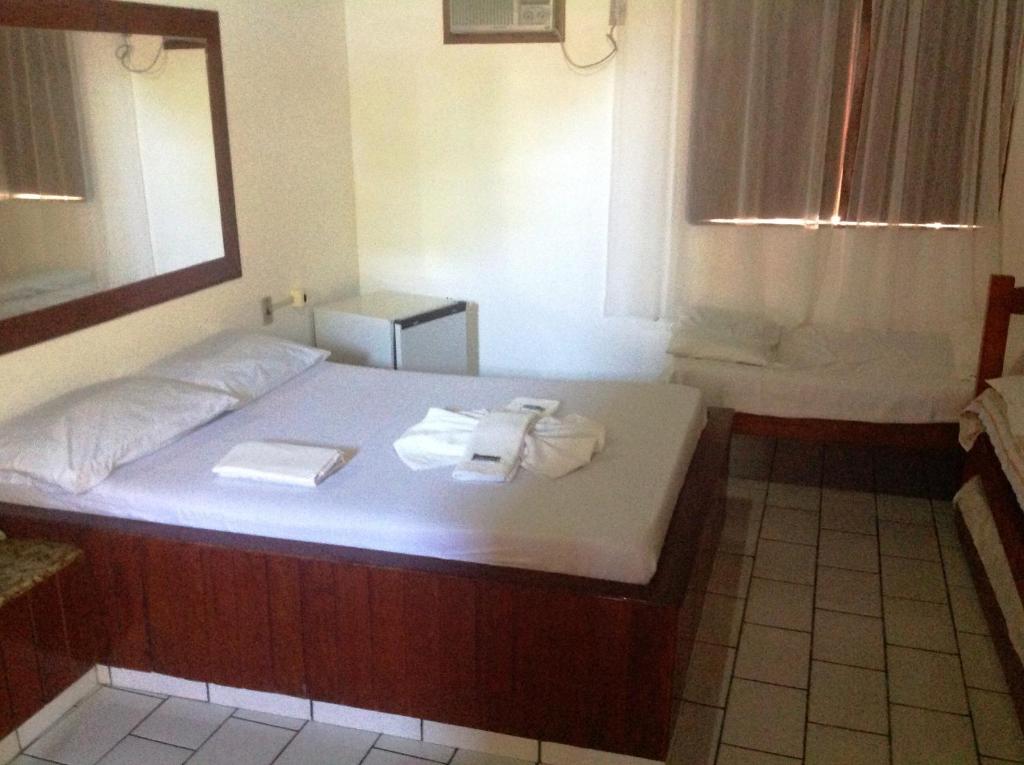 Postel nebo postele na pokoji v ubytování Cururupe Praia Hotel