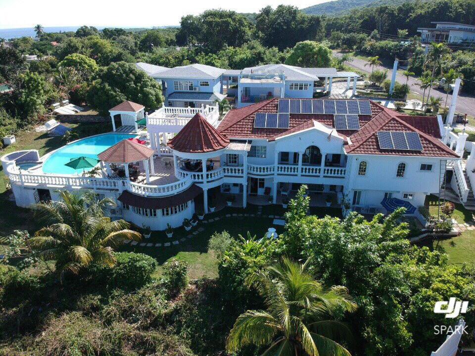 an aerial view of a large house with a swimming pool at Royal Vista Villa in Duncans