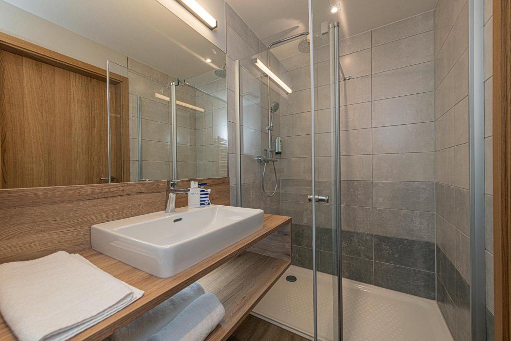 Koupelna v ubytování ADORO Aparthotel