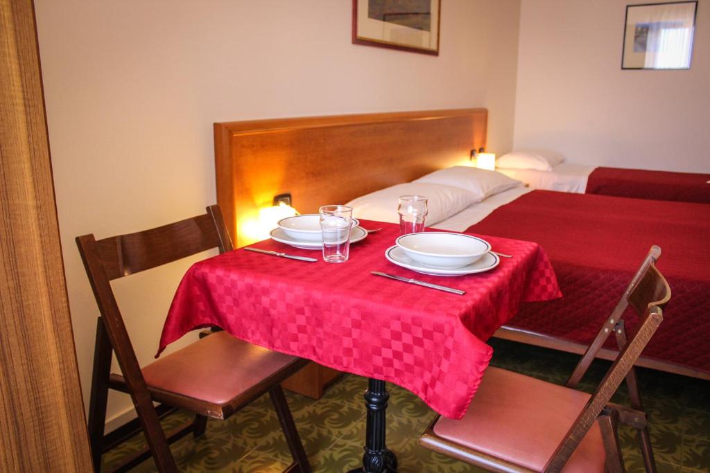 Postel nebo postele na pokoji v ubytování Hotel Centrale