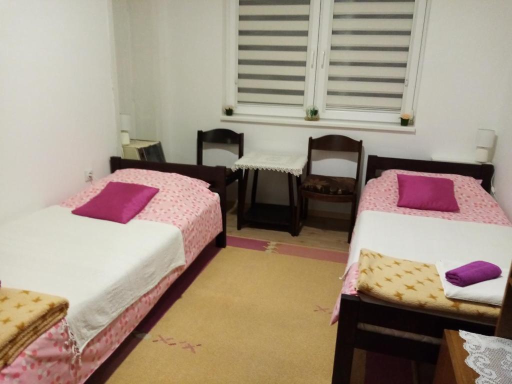 Postel nebo postele na pokoji v ubytování Vila I