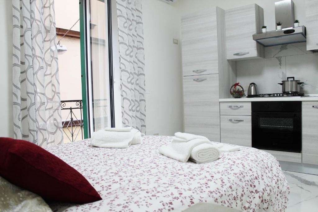 Posteľ alebo postele v izbe v ubytovaní Conforti Apartment