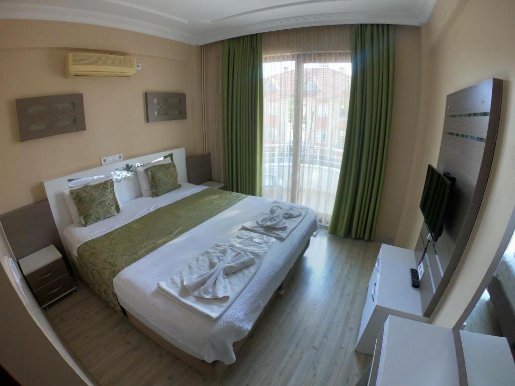 Postel nebo postele na pokoji v ubytování Bellamaritimo Hotel