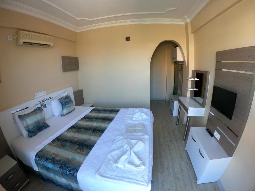Postel nebo postele na pokoji v ubytování Bellamaritimo Hotel