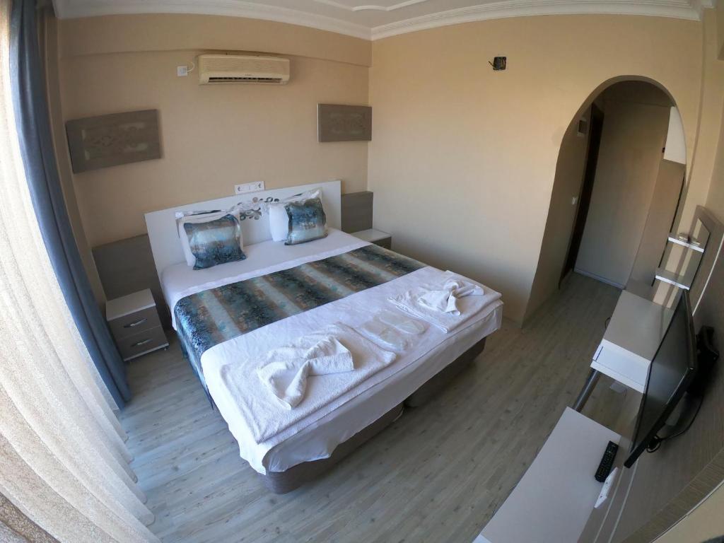 Postel nebo postele na pokoji v ubytování Bellamaritimo Hotel