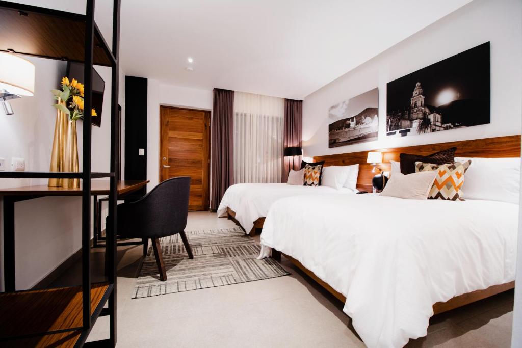 Postel nebo postele na pokoji v ubytování HOTEL MINA REAL MATEHUALA