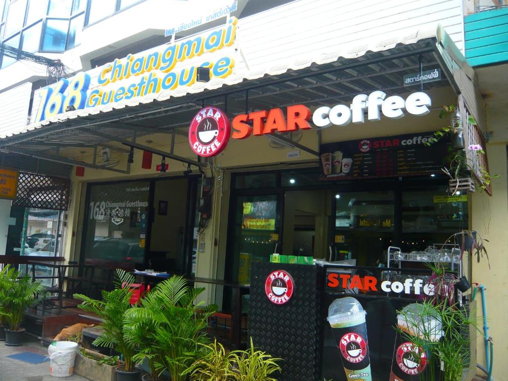 a star coffee shop with a sign on the front of it at 168 Chiangmai Guesthouse in Chiang Mai