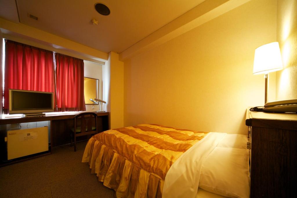 Postel nebo postele na pokoji v ubytování Hotel Pao