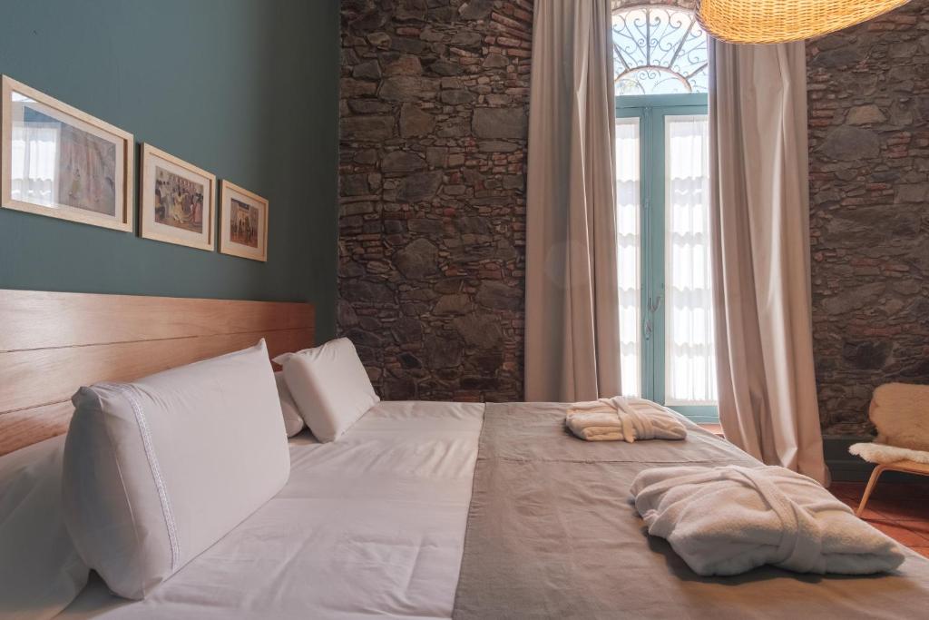 Postel nebo postele na pokoji v ubytování Posada Plaza Mayor