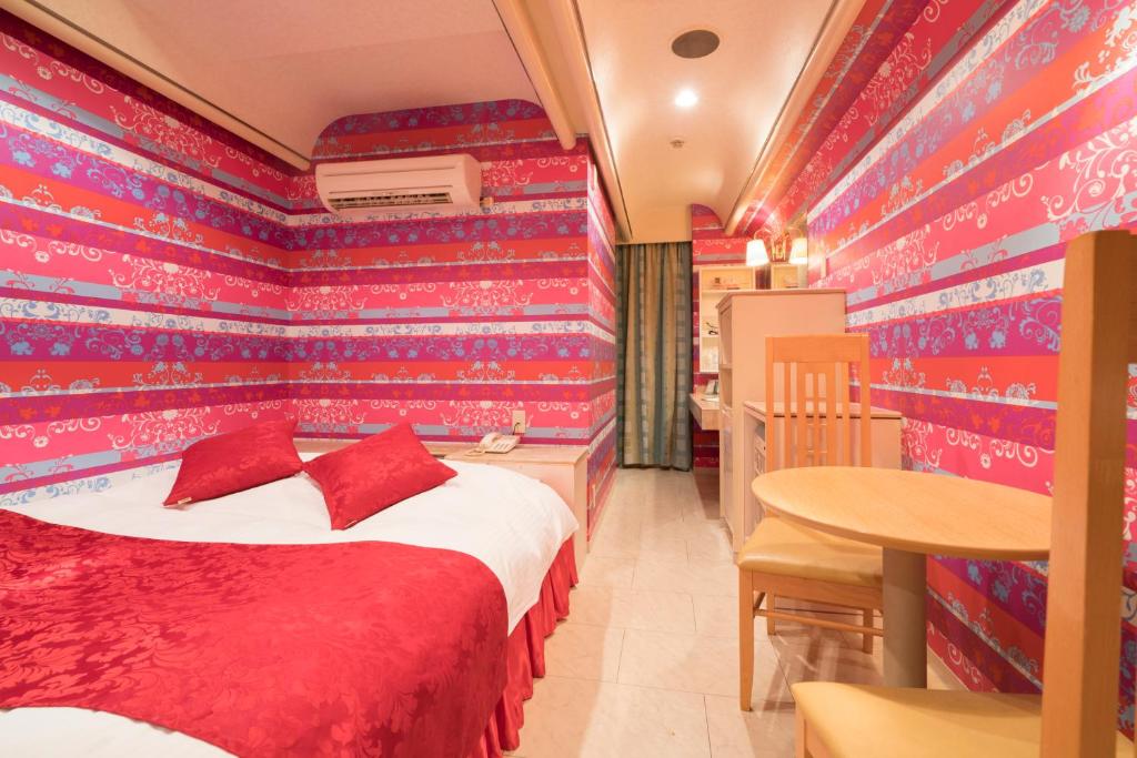 Postel nebo postele na pokoji v ubytování Hotel Route One
