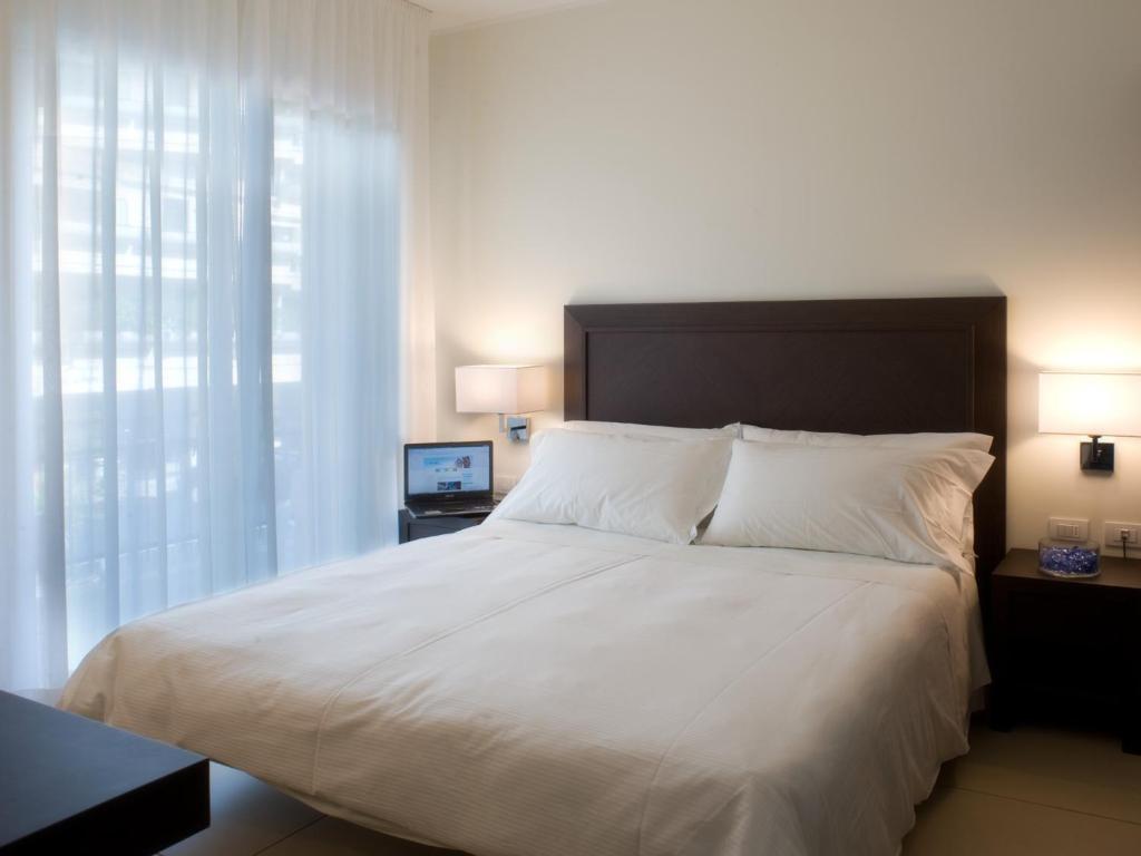 Postel nebo postele na pokoji v ubytování Hotel La Cappuccina