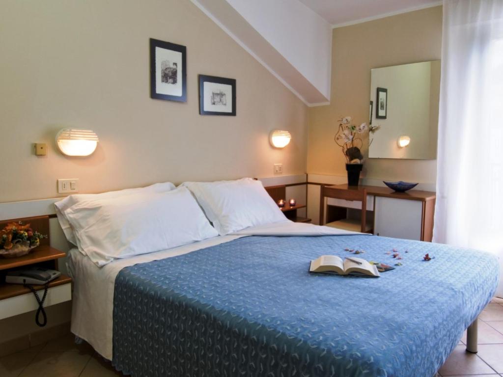 Postel nebo postele na pokoji v ubytování Hotel La Cappuccina