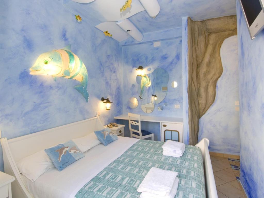 Postel nebo postele na pokoji v ubytování Hotel La Cappuccina