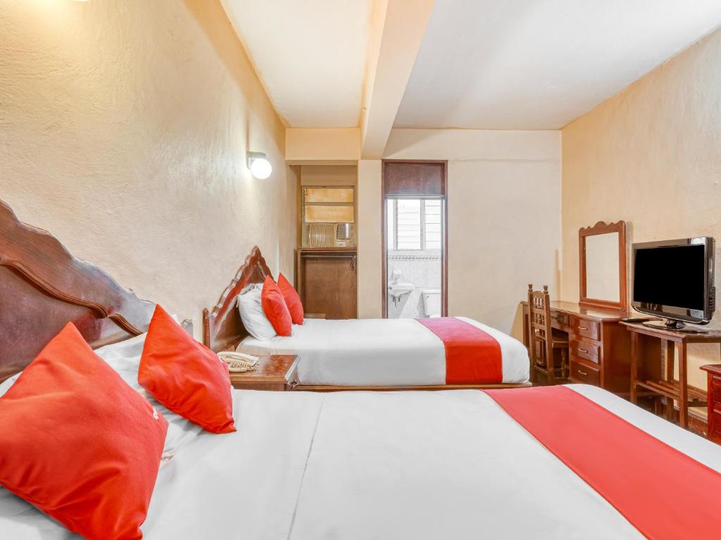 Postel nebo postele na pokoji v ubytování Hotel Esperanza, Oaxaca Centro