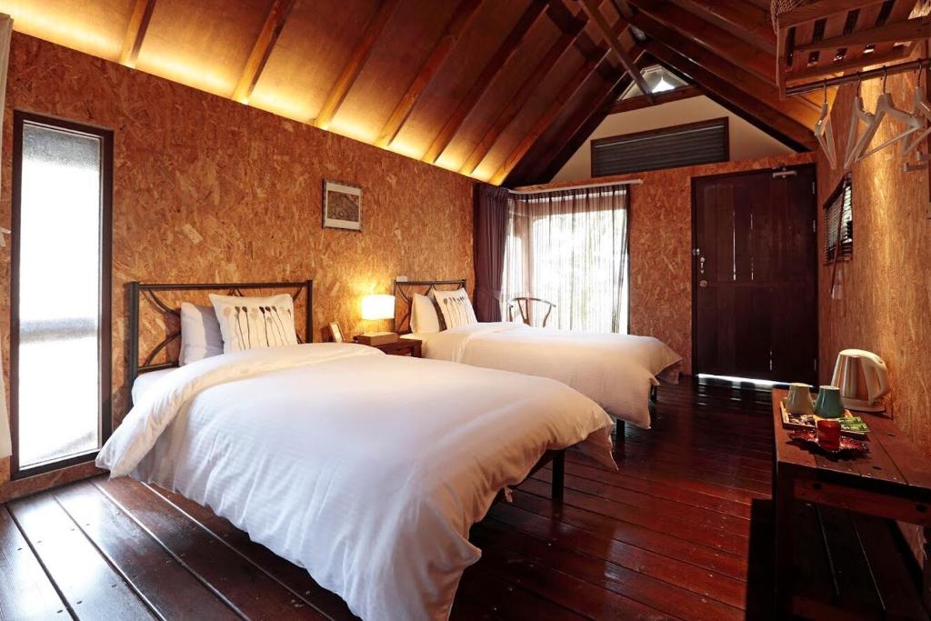 Voodi või voodid majutusasutuse 藏青谷 莊園Valley Statt Manor toas