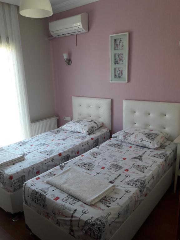 A bed or beds in a room at Sapphire Hotel