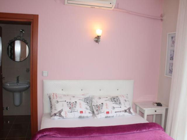 A bed or beds in a room at Sapphire Hotel