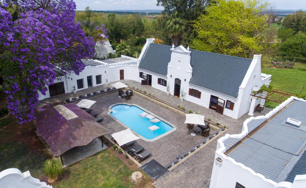 an aerial view of a house with a swimming pool at Stellenhof Guest House in Addo