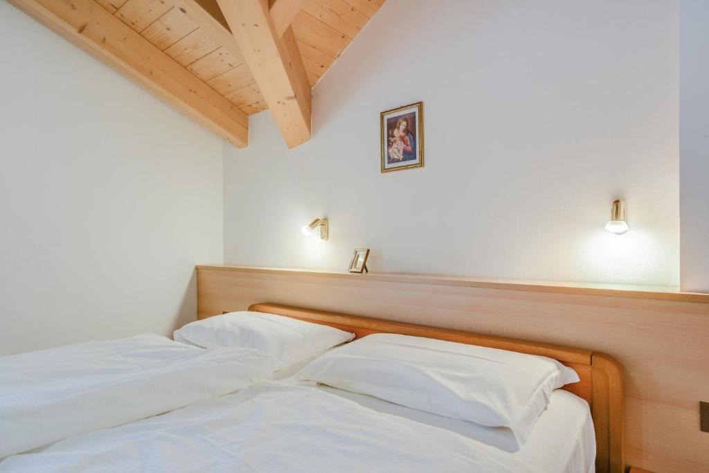 Postel nebo postele na pokoji v ubytování Appartamento Maura