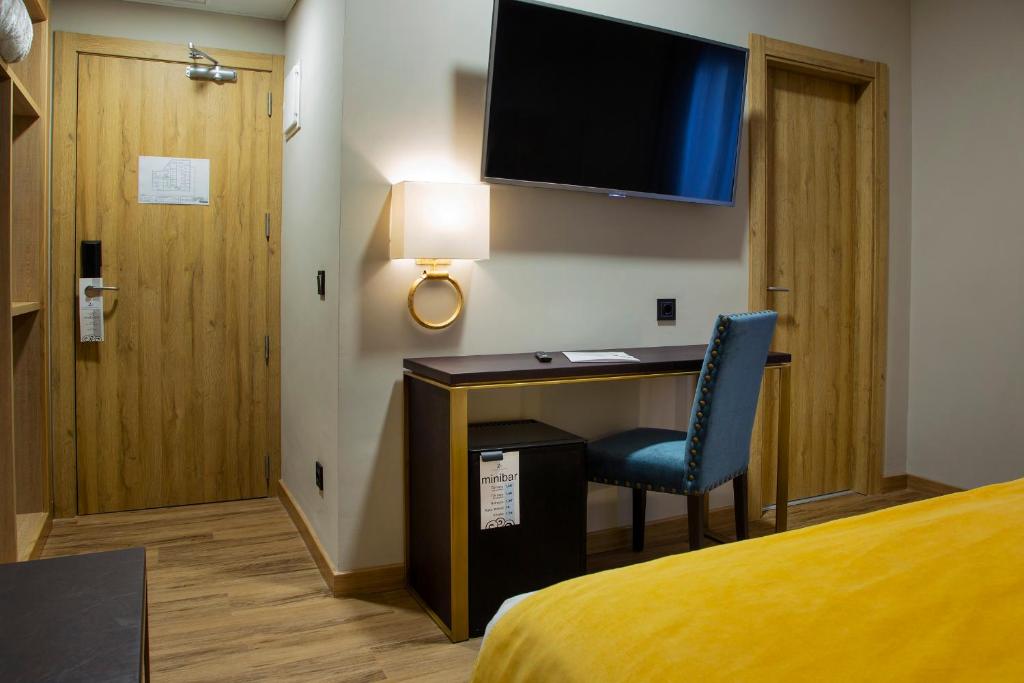 TV a/nebo společenská místnost v ubytování Hotel Zentral Mayoral