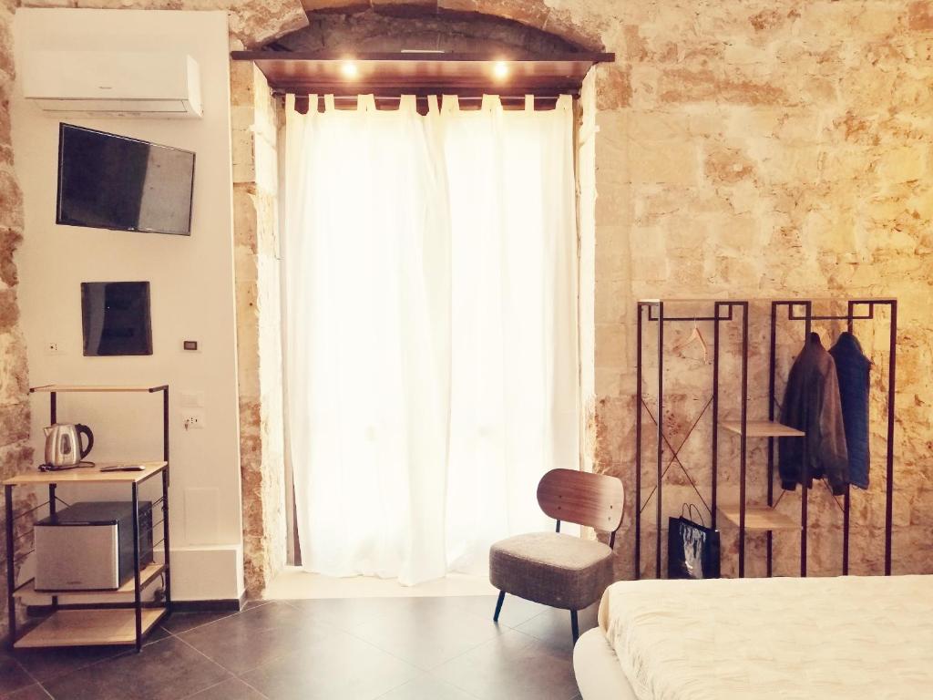 Postel nebo postele na pokoji v ubytování GARIBALDI MAISON DE CHARME