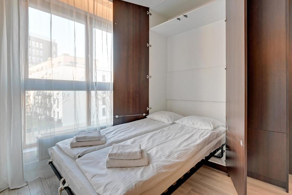 Posteľ alebo postele v izbe v ubytovaní Aura Apartments Old Town