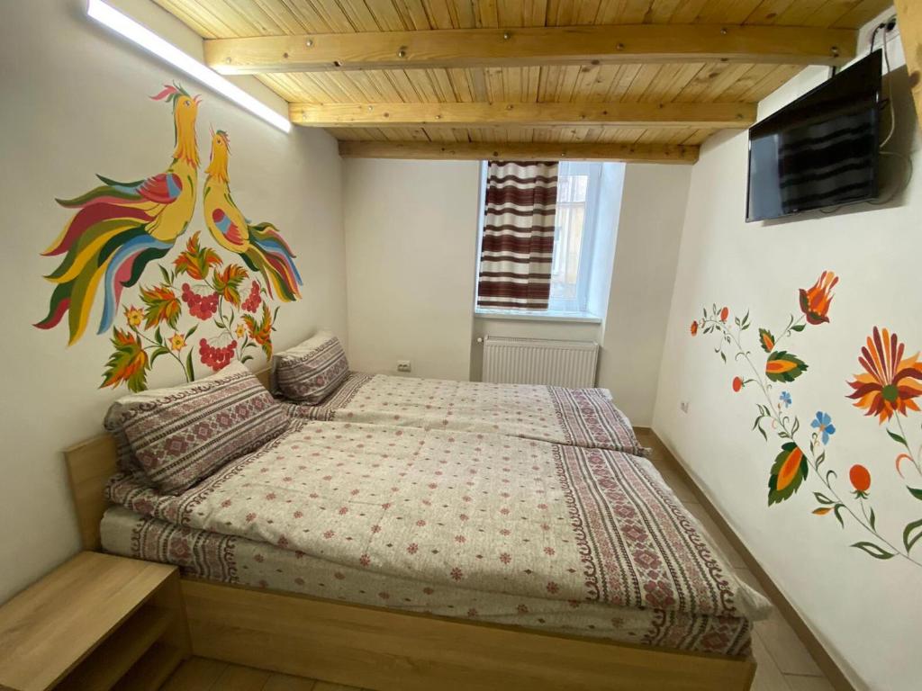 A bed or beds in a room at Etno Hostel