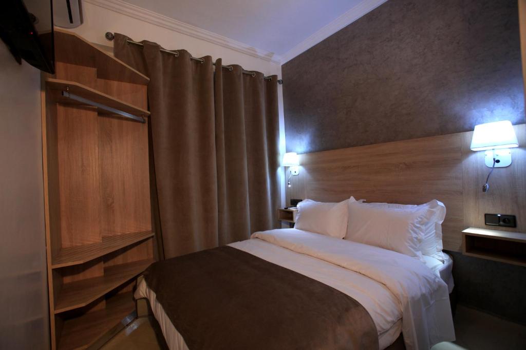 Postel nebo postele na pokoji v ubytování Hotel Ichbilia فندق اشبيلية