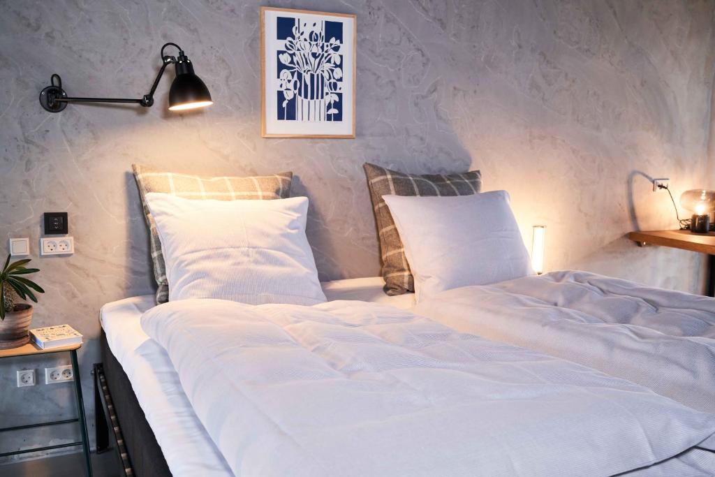 Postel nebo postele na pokoji v ubytování Hotel GUESTapart