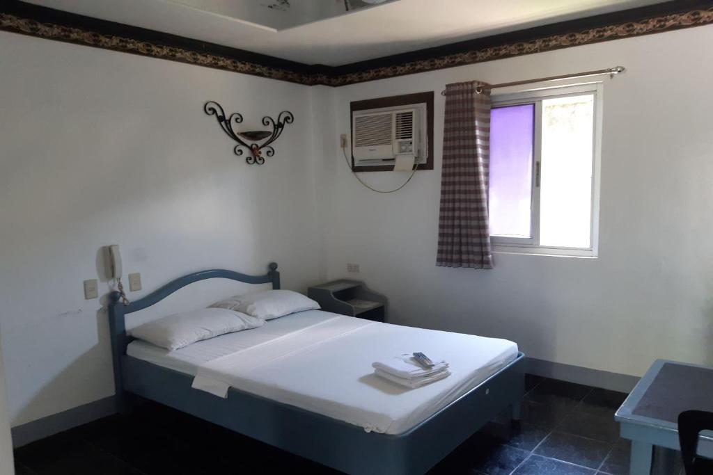 Postel nebo postele na pokoji v ubytování SM Travelodge