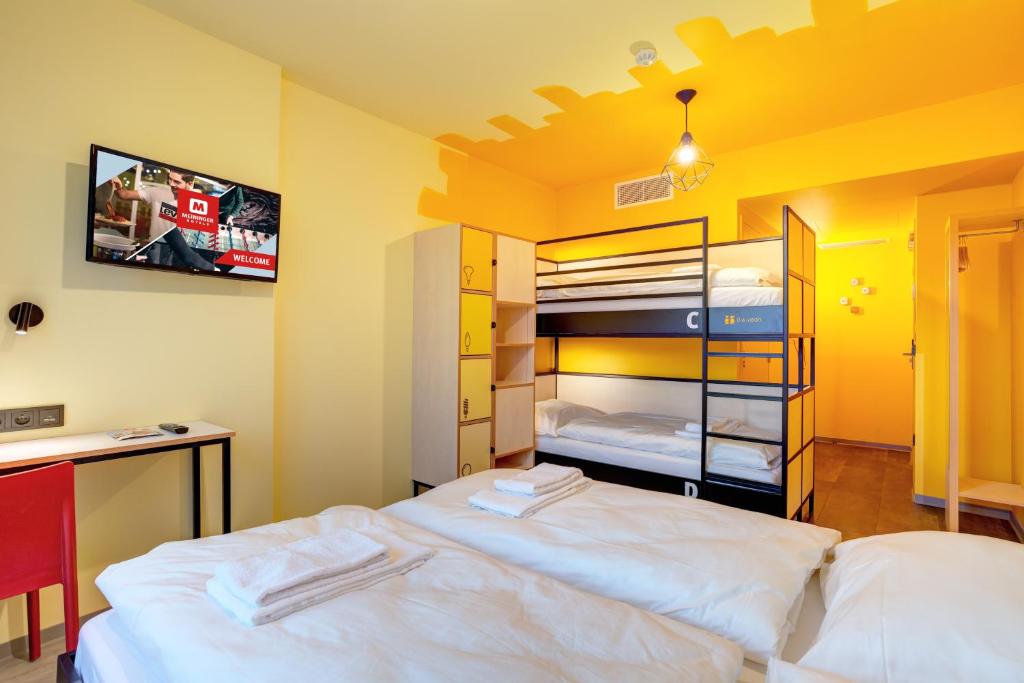 Postel nebo postele na pokoji v ubytování MEININGER Hotel Lyon Centre Berthelot