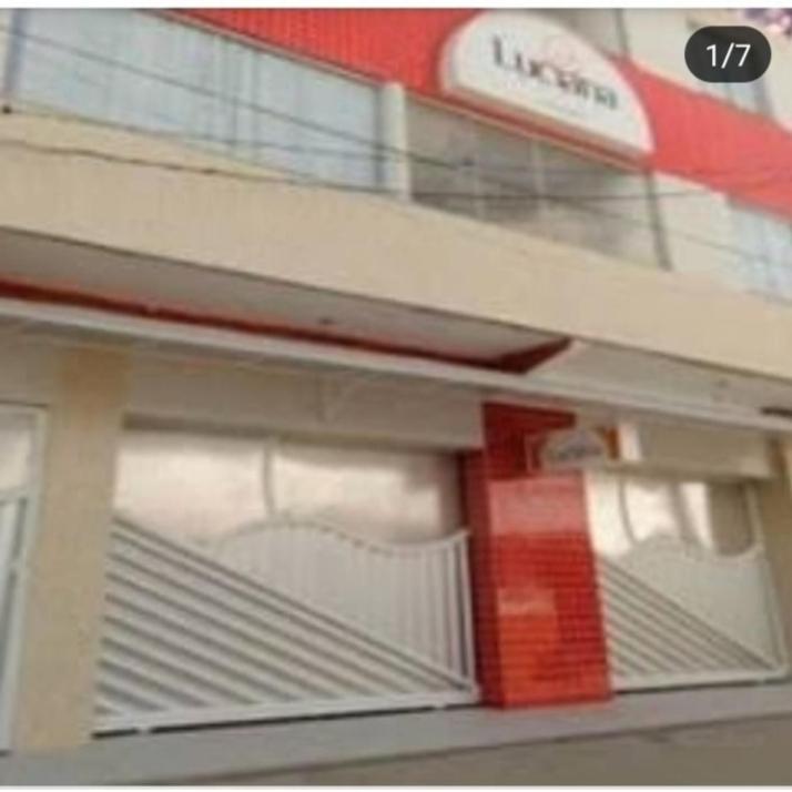a close up of a store front with a window at HOTEL LUCIANA in Serrinha