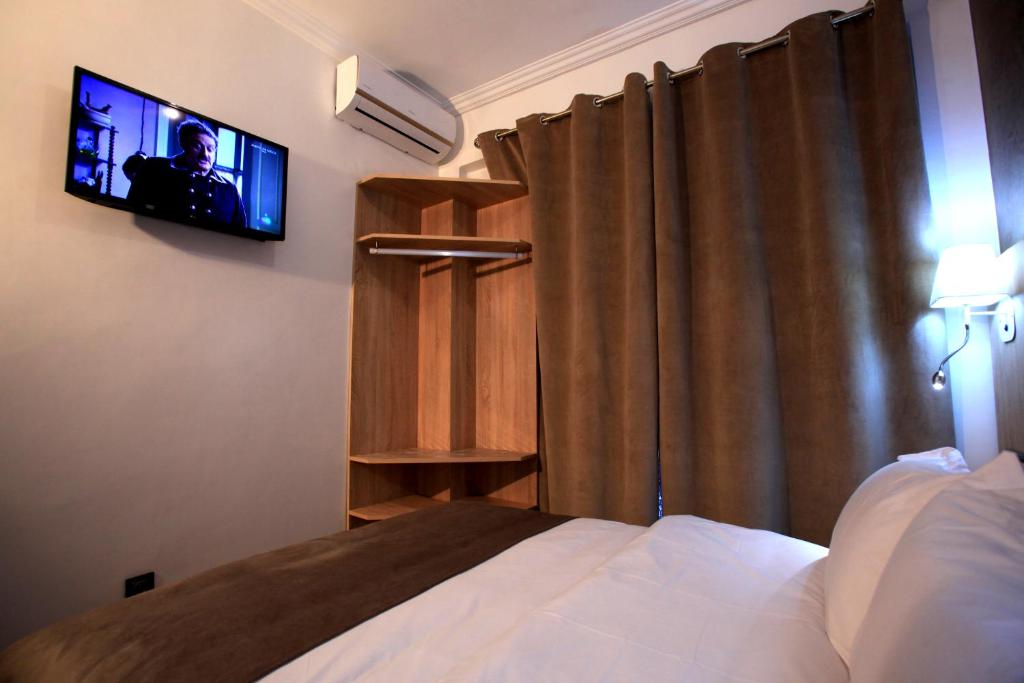 Postel nebo postele na pokoji v ubytování Hotel Ichbilia فندق اشبيلية