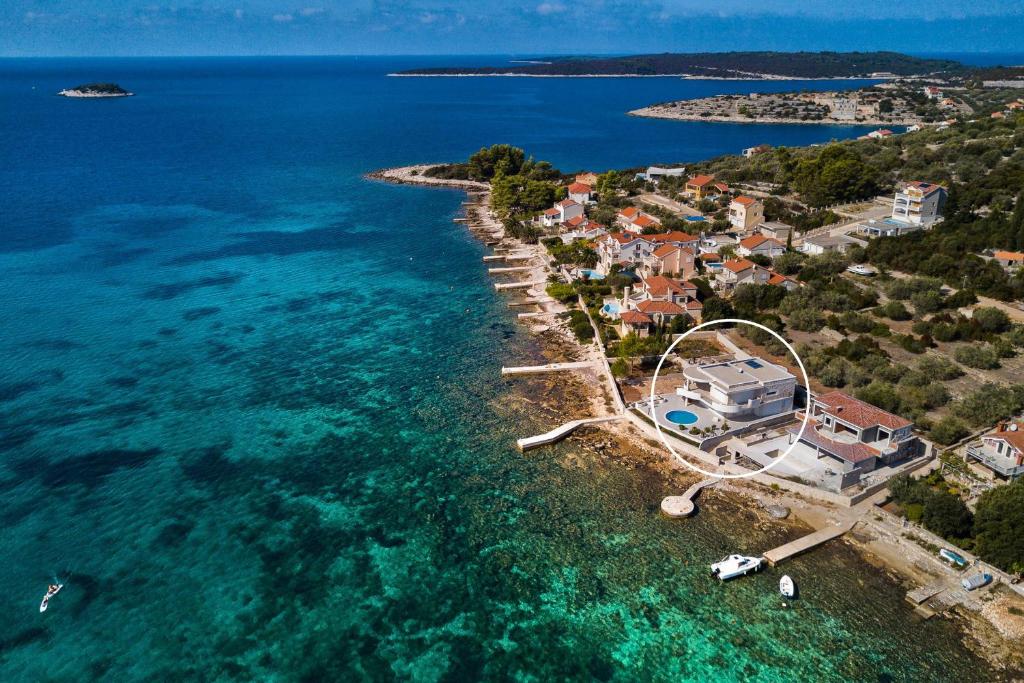 an aerial view of a small island in the ocean at Villa Soleil in Vela Luka