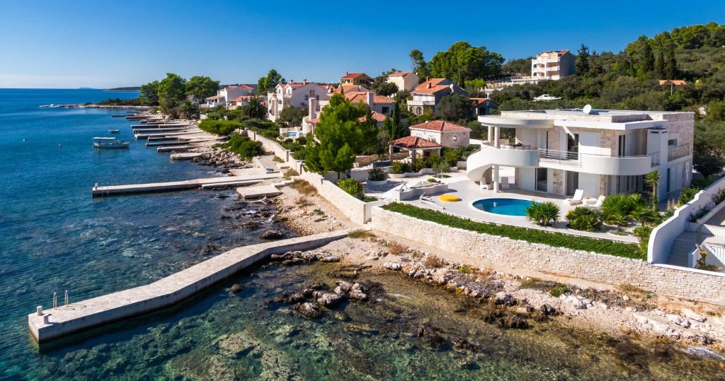 an aerial view of a house next to the water at Villa Soleil in Vela Luka
