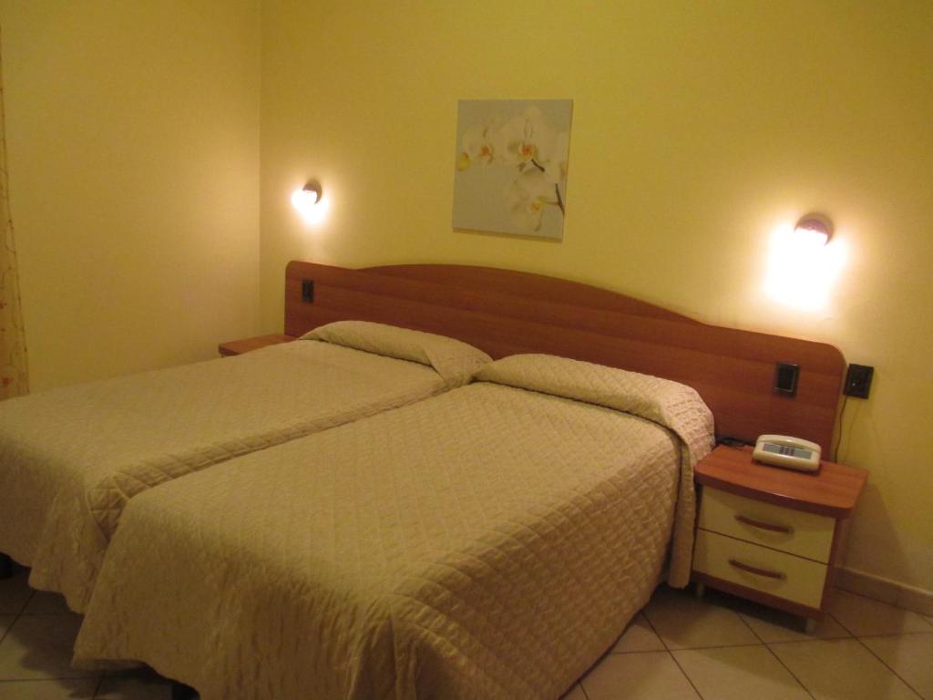 Postel nebo postele na pokoji v ubytování Hotel Ristorante Sbranetta