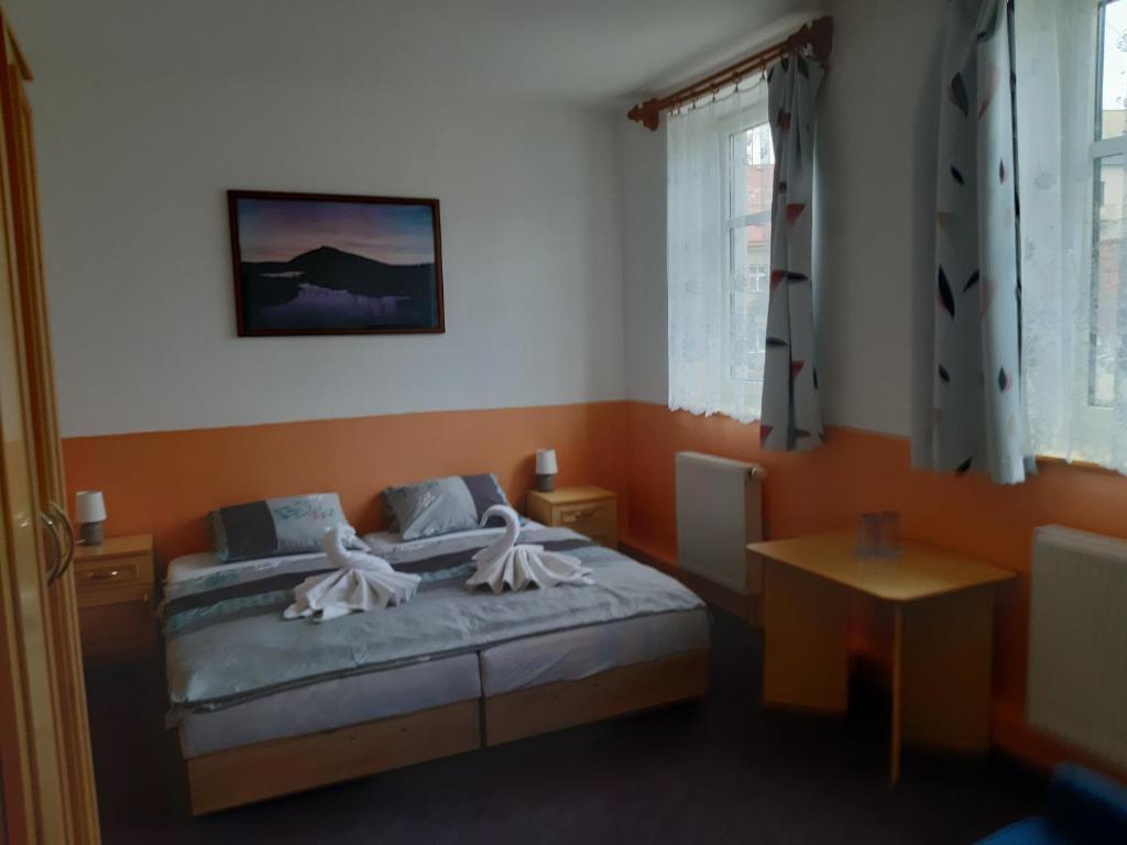 Postel nebo postele na pokoji v ubytování Pension Kobr