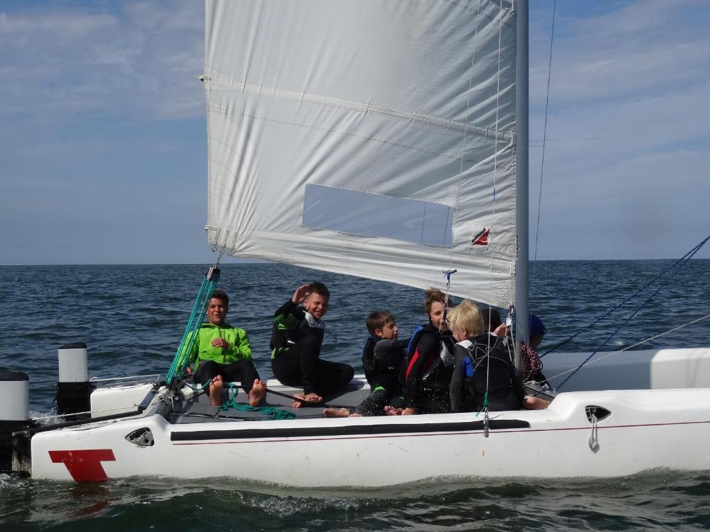 a group of people on a sail boat in the water at Sopot 34 przy plaży in Sopot