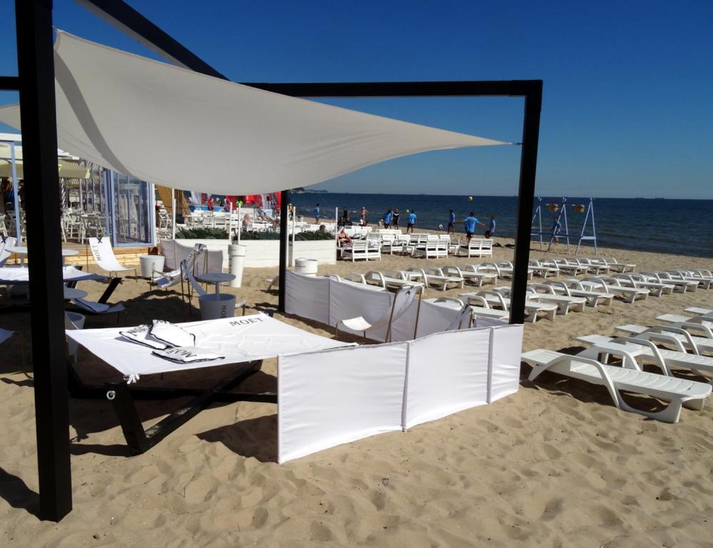 a group of chairs and tables on the beach at Sopot 34 przy plaży in Sopot