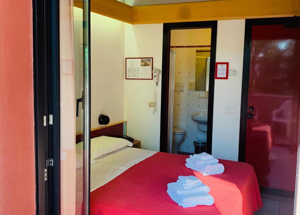 Postel nebo postele na pokoji v ubytování Hotel Giglio
