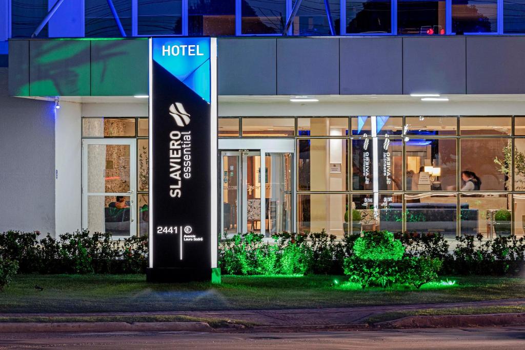 a hotel sign in front of a building at night at Slaviero Porto Velho in Porto Velho